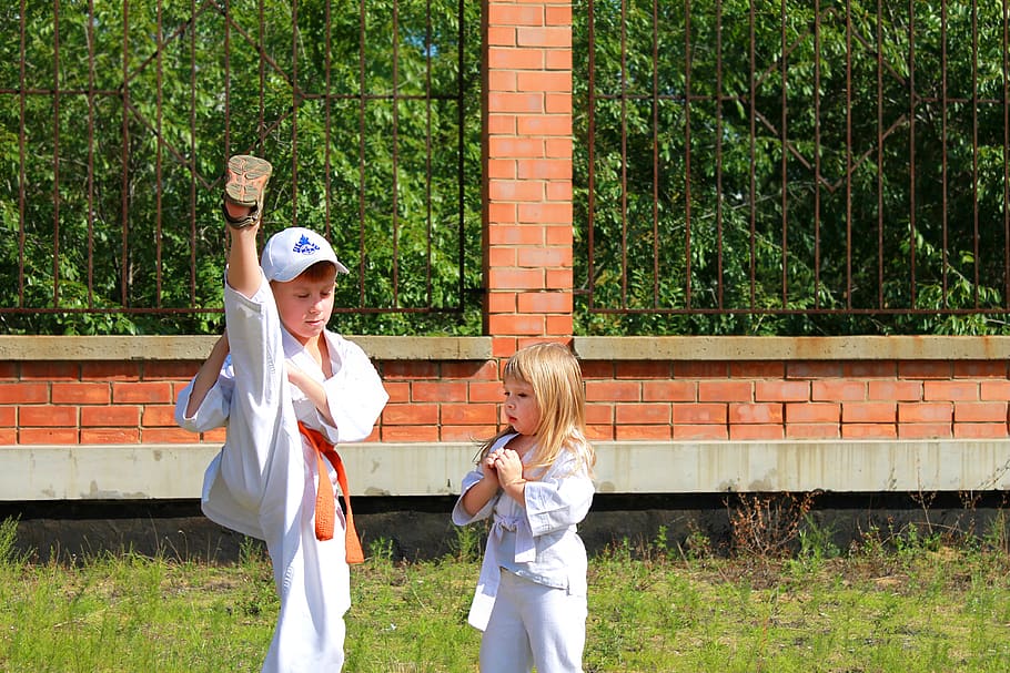 Boy showing girl karate